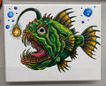 Colorful illustration of an angler fish with a on a white background made with acrylic markers on canvas.