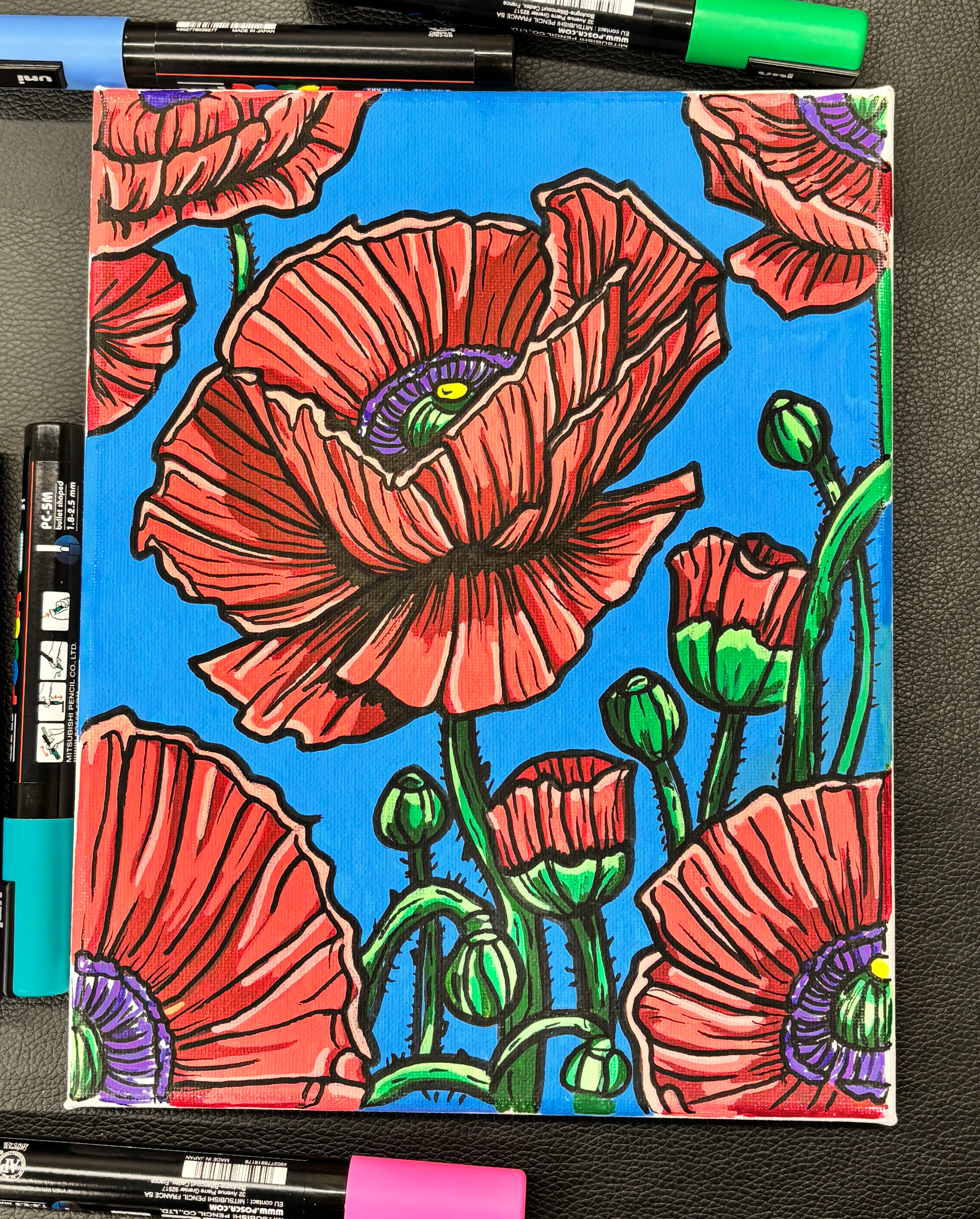bright red painting of poppies on blue background